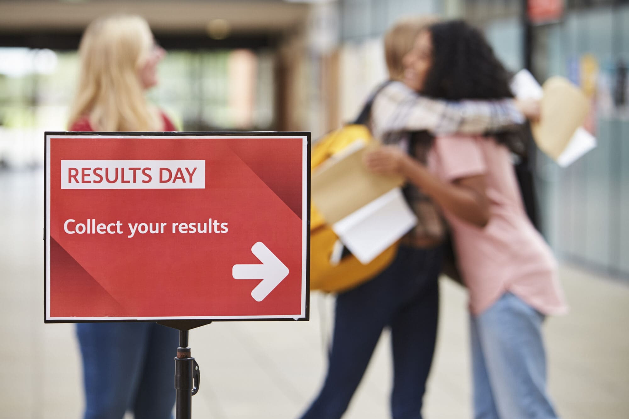 Female College Students Celebrating Exam Results EXAM RESULTS ANXIETY