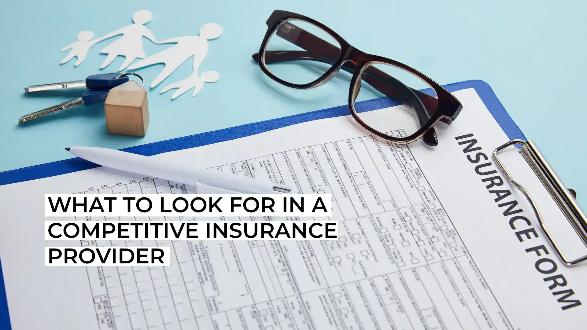Insurance form with glasses and stationery for competitive insurance provider.