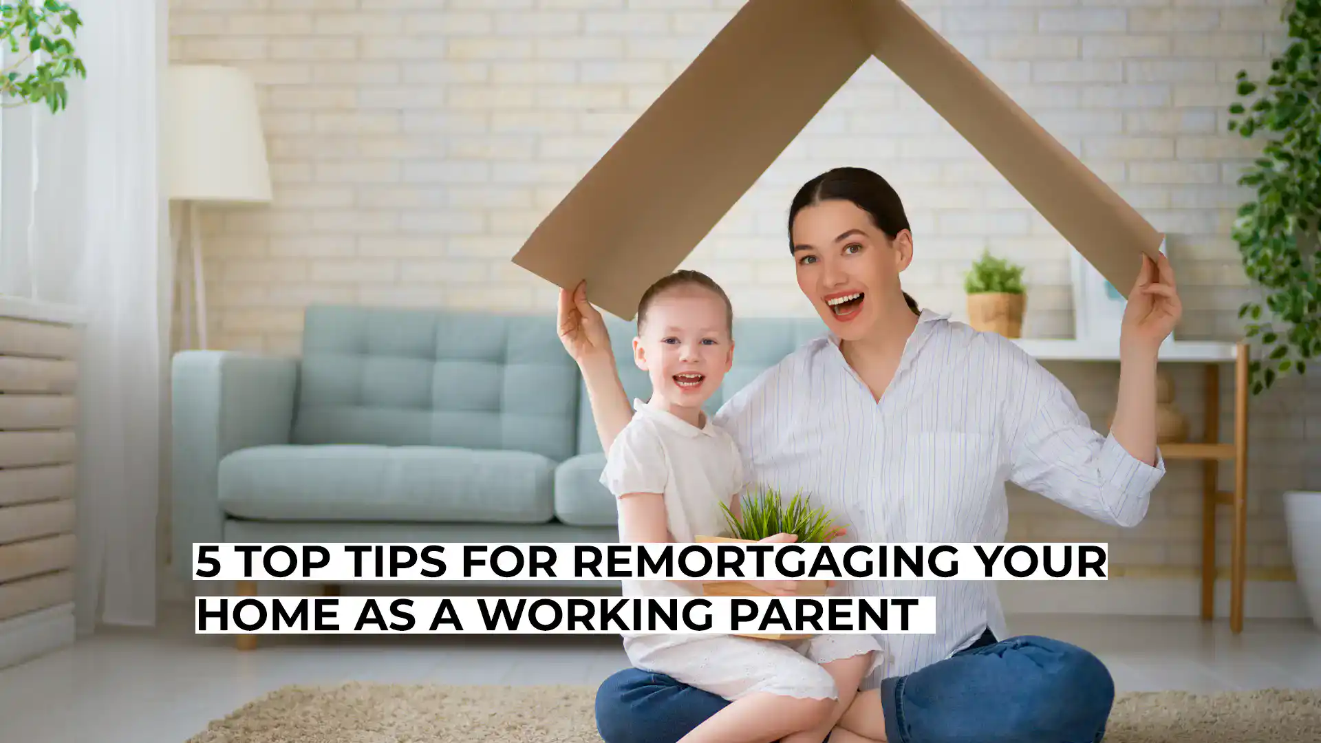 Happy mother and child with cardboard house in living room.