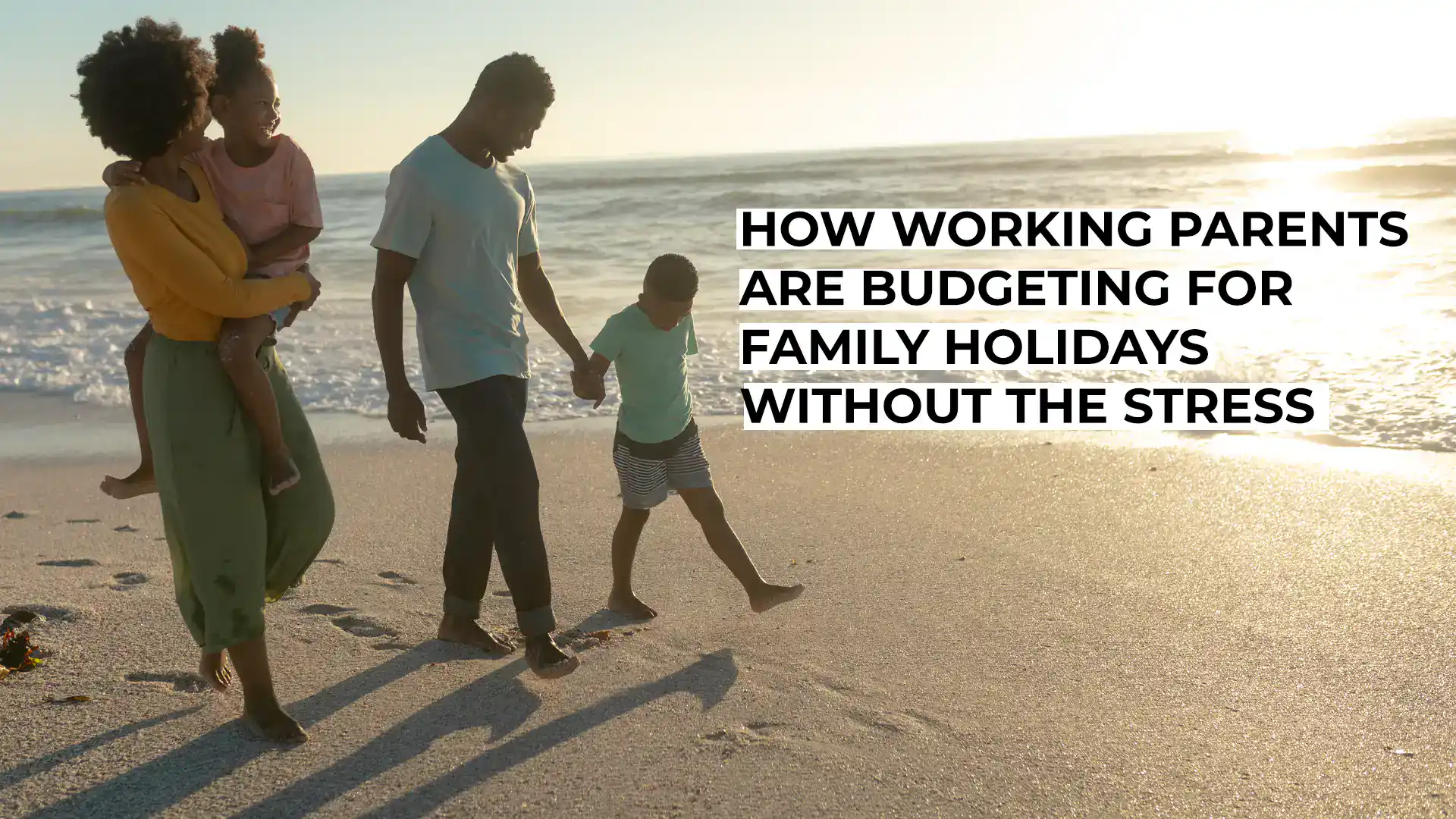 Family walking on the beach at sunset, enjoying a holiday together.