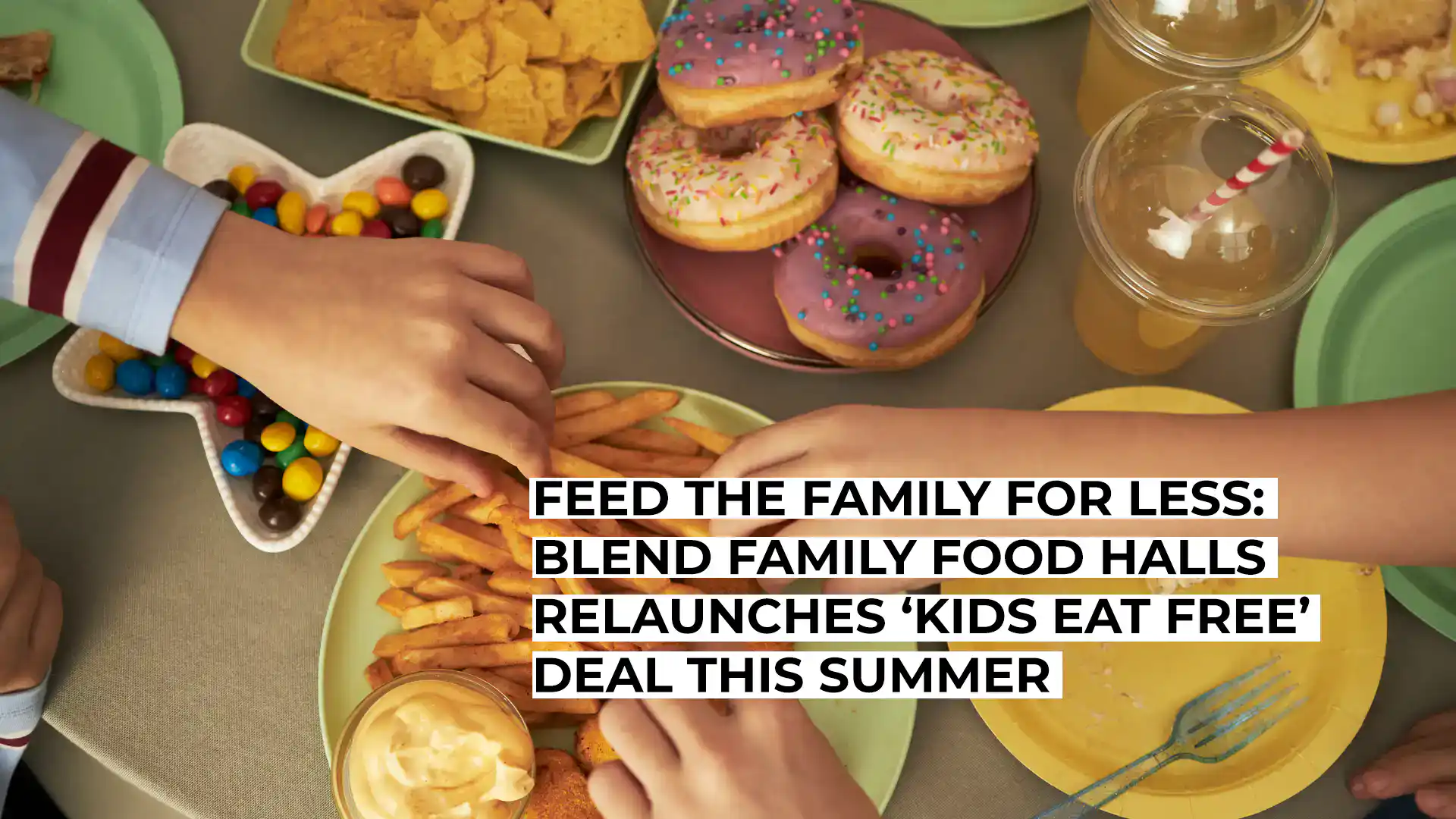 Family enjoying food at a community food hall with kids' meal deals.