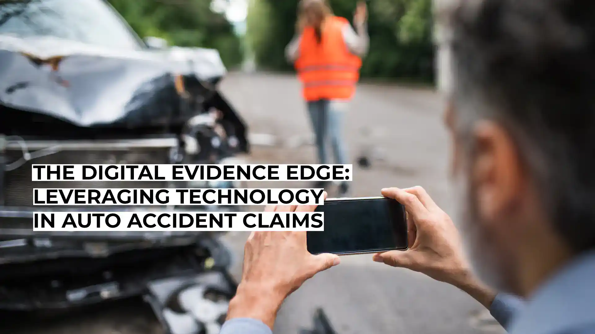 Person taking photo of car accident for digital evidence.