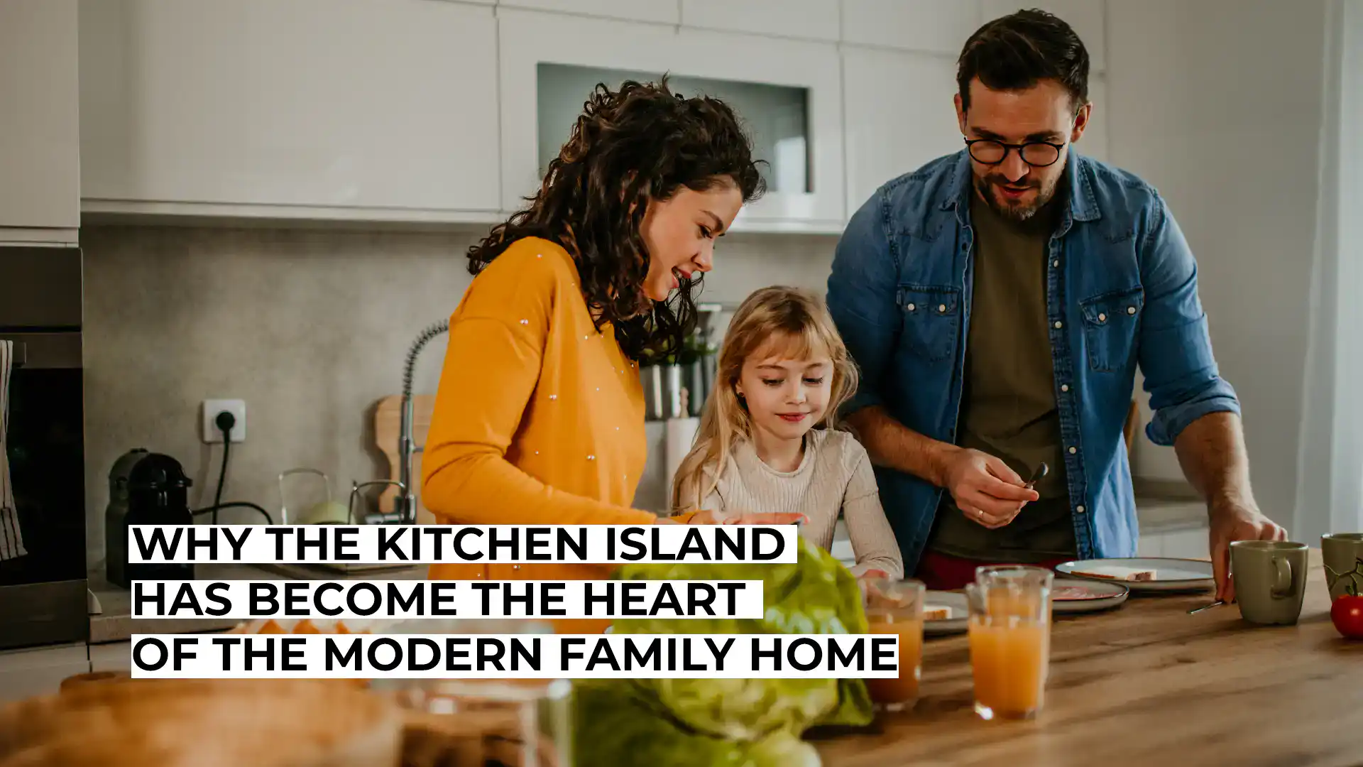 Family enjoying cooking together in a modern kitchen with a kitchen island.