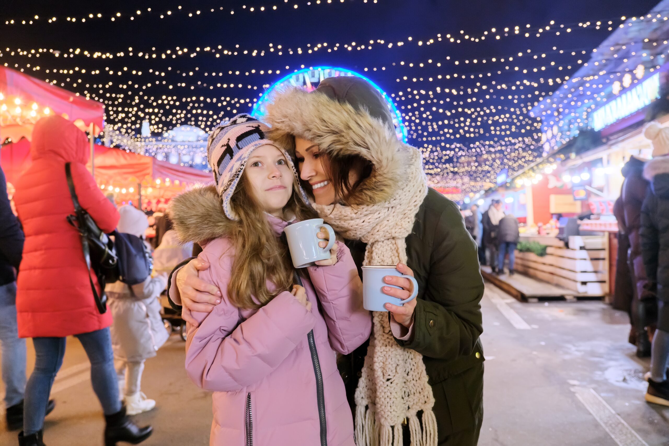 Mother and daughter enjoying the festive Christmas markets